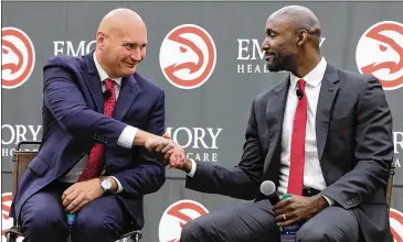  ?? CURTIS COMPTON/CURTIS.COMPTON@AJC.COM ?? General manager Travis Schlenk introduces Lloyd Pierce as the 13th full-time coach in the Atlanta history of the NBA basketball franchise May 14, 2018. Schlenk fired Pierce on Monday.