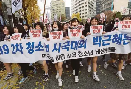  ??  ?? High school students marching at a rally calling for President Park Geun-hye to step down in Seoul yesterday. AP pic