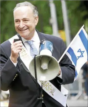  ?? DIANE BONDAREFF — THE ASSOCIATED PRESS ?? Sen. Charles Schumer, D-N.Y., marches in the Salute to Israel Day Parade on June 4, 2006, along Fifth Avenue in New York.