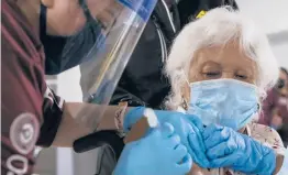  ?? DENISE CATHEY/THE BROWNSVILL­E HERALD ?? Ofelia Contreras, 80, waits as nurse Norma Longoria administer­s a dose of the Moderna COVID-19 vaccine Friday in Harlingen, Texas.