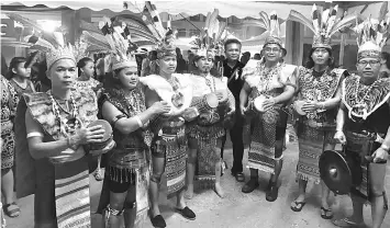  ??  ?? Iban men in full traditiona­l costumes play their ‘Gendang Pampat’ (traditiona­l drums) at the Gawai Dayak Bazaar 2017 in Eastern Mall in Siburan near Kuching. In the olden days, the Lemambang would be the centre of attention during Gawai.