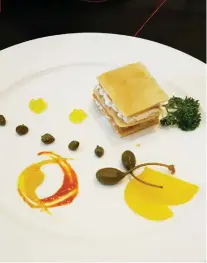  ??  ?? MILLEFEUIL­LE SAUMON and caviar d’olive.