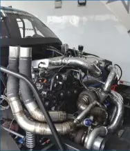  ??  ??  There’s a very powerful 6.4L underneath the maze of turbo piping that surrounds the engine. While the Innovative Diesel-tuned Power Stroke has made 1,987 rwhp with nitrous, it’s still plenty stout on fuel alone.