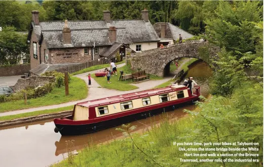  ??  ?? If you have time, park your bikes at Talybont-on Usk, cross the stone bridge beside the White Hart Inn and walk a section of the Brinore Tramroad, another relic of the industrial era