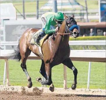  ?? Benoit Photo ?? MASTERY AND MIKE SMITH are in control down the stretch in the San Felipe Stakes, but Smith knew something was wrong right after the race and the unbeaten colt now faces possible career-ending surgery.