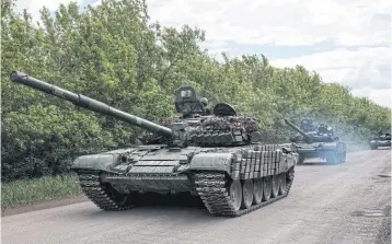  ?? AFP ?? Ukrainian tanks are seen on a road near Bakhmut, eastern Ukraine on Sunday.