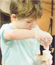  ?? ?? Marty Stelk, of Homewood, stirs a molding liquid to make a replica of a human heart with the new 3D printer.