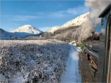  ?? JOHN COOPER-SMITH ?? When the second daily ‘Jacobite’ train was introduced, it departed Fort William in the evening rather than the afternoon, affording rare photograph­ic opportunit­ies. No. 44871 crosses Lochy Bridge, with the ruins of Old Inverlochy Castle and the lower...