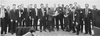  ??  ?? Masing (front, seventh right) presents a memento to Caruthers, as other Sarawak delegates look on. Also seen are Dr Jerip on Caruthers’ left, and Julaihi on Masing’s right.