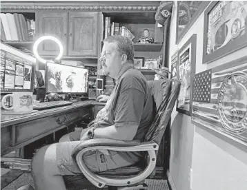  ?? CHRIS O’MEARA/AP ?? MIke Boylan is shown at his home office in Oldsmar. As Hurricane Ida barreled toward Louisiana in August, Boylan hit the road with live reports for his social media followers. “When I started, I only focused on Florida,” he said. “And then I got some people getting upset because I wasn’t talking about Texas storms or North Carolina storms.”