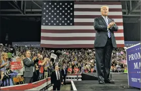  ?? The New York Times/GABRIELLA DEMCZUK ?? President Donald Trump makes his entrance Tuesday evening at a rally in Charleston, W.Va., after his former campaign chairman Paul Manafort was convicted on tax and bank fraud charges and his former personal attorney Michael Cohen pleaded guilty to a series of felonies. Trump said he felt “badly for both” men, but he largely ignored Cohen’s case.