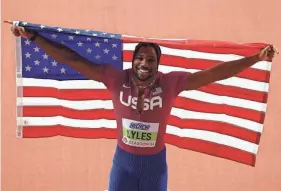  ?? HANNAH MCKAY/REUTERS FILE ?? Noah Lyles celebrates after a second-place finish in the 60-meter final at the World Athletics Indoor Championsh­ips on March 1 in Glasgow, Scotland.