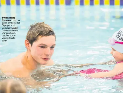  ??  ?? Swimming lessons Learn to Swim ambassador, Olympic and Commonweal­th Games swimmer Duncan Scott, teaches some youngsters to swim