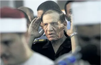  ?? THE ASSOCIATED PRESS FILES ?? Then Egyptian armed forces Chief of Staff Sami Annan performs prayers for 16 Egyptian soldiers who were killed, in Cairo, Egypt, on Aug. 5, 2012. Annan was arrested on Tuesday on accusation­s of incitement and forgery.