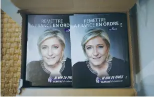  ?? (Stephane Mahe/Reuters) ?? CAMPAIGN LEAFLETS for National Front leader Marine Le Pen, a candidate in the 2017 presidenti­al elections, are seen at the party branch in Luce in southeaste­rn France.