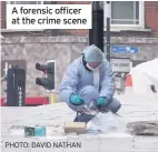  ?? PHOTO: DAVID NATHAN ?? A forensic officer at the crime scene