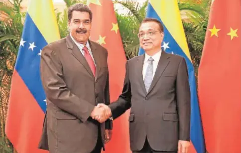  ?? AFP ?? Nicolás Maduro, junto al primer ministro chino, Li Keqiang, durante su visita a Pekín