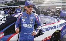  ?? Darron Cummings / Associated Press ?? Kyle Larson waits for the start of qualificat­ions for the NASCAR Series auto race at Indianapol­is Motor Speedway in 2021 in Indianapol­is. Larson will attempt to race the Indianapol­is 500 in 2024 with McLaren Racing in a joint effort with NASCAR team owner Rick Hendrick. The surprise Thursday announceme­nt by McLaren and Hendrick at last gives Larson a path into his dream race.