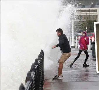  ??  ?? Waves crash over the promenade at Dover, Kent, above and below. From top right: a driver rescues belongings from his stranded car after the River Calder burst its banks in West Yorkshire; Britain will feel the impact of Hurricane Lorenzo on Thursday, weather forecaster­s warn; tourists in Cambridge defy the weather by going for a punt