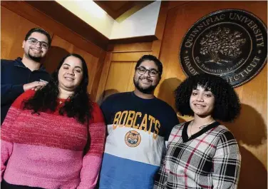  ?? Arnold Gold/Hearst Connecticu­t Media ?? From left, Sebastian Vacco, with his younger triplet siblings, Ashley, Lucas and Jade, at Quinnipiac University in Hamden last week. The triplets from Nanuet, N.Y., all transferre­d to Quinnipiac.