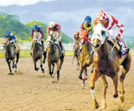  ?? FILE ?? Further And Beyond (right), ridden by Ian Spence, wins the Two-Year-Old Stakes at Caymanas Park on Sunday, December 27, 2020.