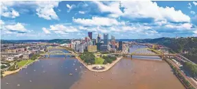  ?? PAWEL.GAUL/GETTY IMAGES ?? An aerial view of Pittsburgh looking from the confluence of the Allegheny and the Monongahel­a rivers that form the Ohio River.