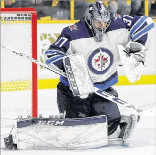  ?? CP PHOTO ?? Winnipeg Jets goalie Connor Hellebuyck makes a stop against the Nashville Predators during a playoff game in Nashville, Tenn., on May 10.