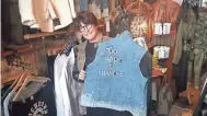  ?? STEVE JAGLER / MILWAUKEE JOURNAL SENTINEL ?? Paula Hare, owner of Firehouse Communicat­ions in Milwaukee, has started a new "side hustle" business featuring vintage women's clothing, called Gearhead Fashion.