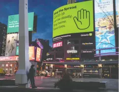  ?? CARLOS OSORIO / REUTERS FILES ?? The coronaviru­s crisis left once bustling areas like Yonge
and Dundas Square in Toronto mostly deserted.