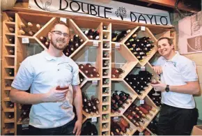  ?? MILWAUKEE JOURNAL SENTINEL PHOTOS BY ANGELA PETERSON, ?? Landon Carus (left) and Daniel Ratzburg are partners in Double Daylo Winery in Wauwatosa. At this time, it's purely a hobby for them.