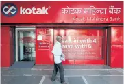  ?? ?? A man walks past the Kotak Mahindra Bank branch in New Delhi.