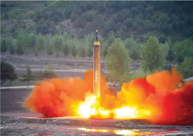  ??  ?? North Korean ballistic rocket Hwasong-12 is launched from an undisclose­d location. (AFP)