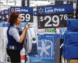  ?? TIMOTHY FADEK/BLOOMBERG. ?? Despite low prices, Walmart stores like this one in Secaucus, New Jersey are still dealing with negative sentiment on a variety of issues.