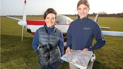  ?? ?? Novice and master: Jane (left) and Amelia after their spin in a tiny motor glider called Rosie