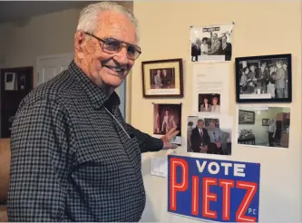  ?? JOE BARKOVICH SPECIAL TO THE WELLAND TRIBUNE ?? Allan Pietz in his living room shows a portion of his photo collection. Pietz, 93, cherishes memories especially from his time in public service.