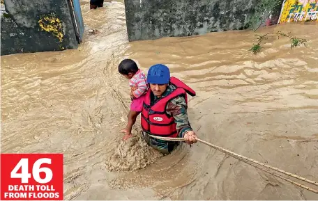  ?? PTI ?? An army jawan rescues a child in flood-water in Tanakpur, Uttarakhan­d, on Wednesday. Several stranded people were rescued from the area. —