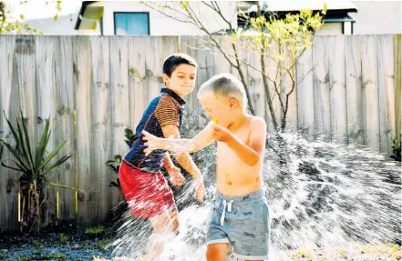  ??  ?? Keep Christmas Day fun and casual by involving the family in awater fight.
Photo / Getty Images