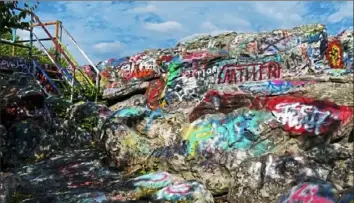  ?? Sarah Simpson/Post-Gazette ?? Colorful graffiti at Dan’s Rock Overlook in Lonaconing, Md.