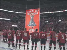  ?? Nick Wass, The Associated Press ?? Washington Capitals players watch the Stanley Cup championsh­ip banner during a bannerrais­ing ceremony before Wednesday’s game against Boston.