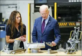  ?? ANDREW HARNIK — THE ASSOCIATED PRESS ?? President Joe Biden speaks with Joanna Zelaya, CEO of Chicago Precision, during a tour at United Performanc­e Metals in Hamilton, Ohio, Friday.