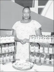  ??  ?? Rodiekah DeFreitas with some of her products at an exhibition