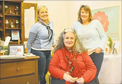  ?? Cassandra Day / Hearst Connecticu­t Media ?? Janet Verney, right, and Deb Thomas, center, are among vendors who are selling their handmade items through Dec. 15 at the Holiday Pop-Up Market in Higganum Center, 3 Candlewood Road. At left is Verney’s friend, who is visiting from the U.K., Joanna Quincey.