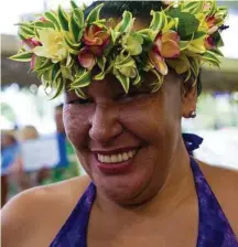  ?? Steve Haggerty photos / TNS ?? Lydia Nga, with the Tourism Office, wears the traditiona­l flower “ei,” first cousin to a Hawaiian lei.