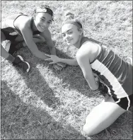  ?? Submitted Photo ?? Lady Bulldogs Desi Meek (left) and Destiny Meija warm up together before the start of the Panther XC Classic at Siloam Springs High School on Sept. 16. Both are members of the Decatur senior girls’ cross country team.