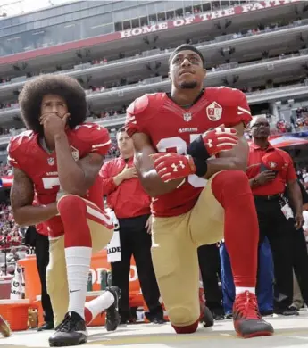  ?? MARCIO JOSE SANCHEZ/THE ASSOCIATED PRESS ?? In 2016, then-San Francisco quarterbac­k Colin Kaepernick, with strong safety Eric Reid, kneeled during the U.S. national anthem as part of a protest against police brutality and social inequality that has spread across sports.