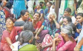  ?? AP ?? Relatives of victims of a bus accident wail near a hospital in Jagtial district of Telangana on Tuesday. The bus was carrying pilgrims.