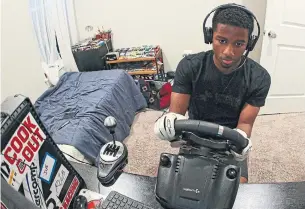  ?? PATRICK SMITH GETTY IMAGES ?? Rajah Caruth, who plans to study motorsport­s management in university, is now in his second year of the Drive for Diversity program. Online racing helped grow his interest in the sport.