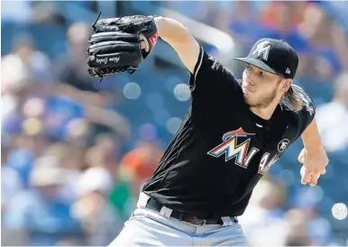  ?? RICH SCHULTZ/AP ?? Miami Marlins pitcher Adam Conley recorded a career-high 11 strikeouts Sunday, including all three in the sixth inning on 10 pitches.