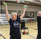  ??  ?? Sharon Gloria, left, exercises during her Senior Stretch class at First Baptist Church.