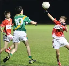  ??  ?? Morgan Ellis of Fethard gets his fist to the ball before Pádraig Kinsella pounces for Buffers Alley.